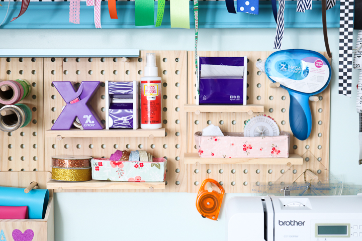 Using craft room pegboards is a great way to easily organize all your craft supplies in once space. 