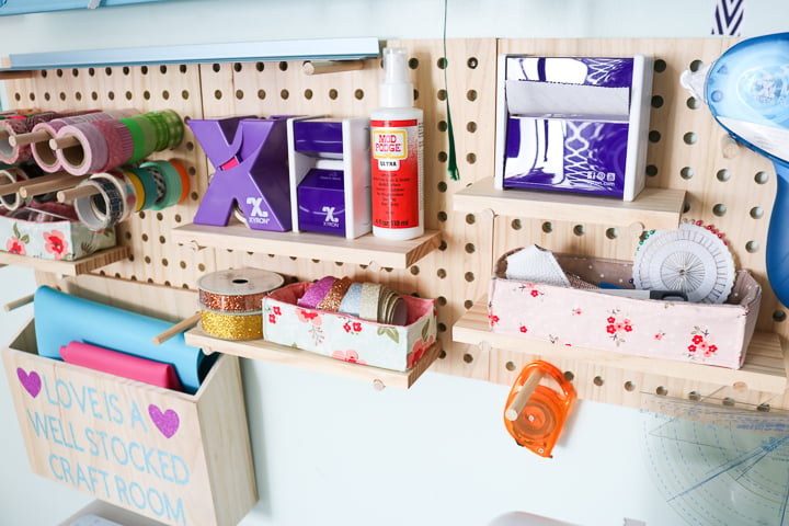 Use a craft room pegboard to organize all your crafting supplies