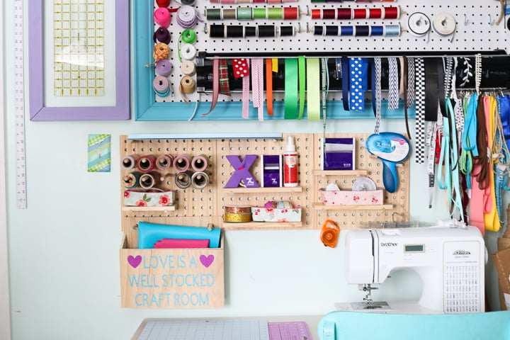 Craft room pegboards are a great way to organize all of your crafting supplies simply!