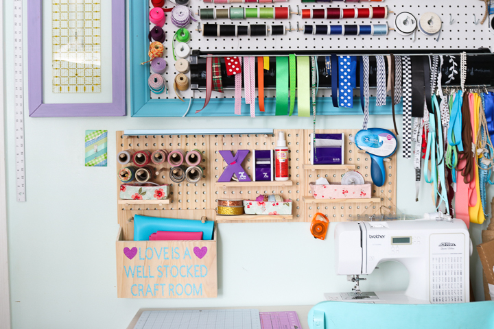 Craft room pegboards are a great way to organize all of your crafting supplies simply!