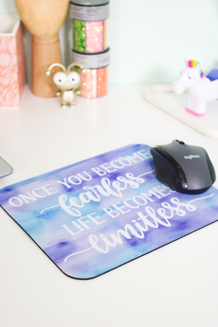 mouse pad with mouse on white table