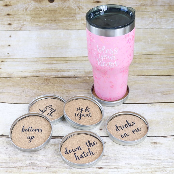 mason jar lids used as coasters with party phrases on them