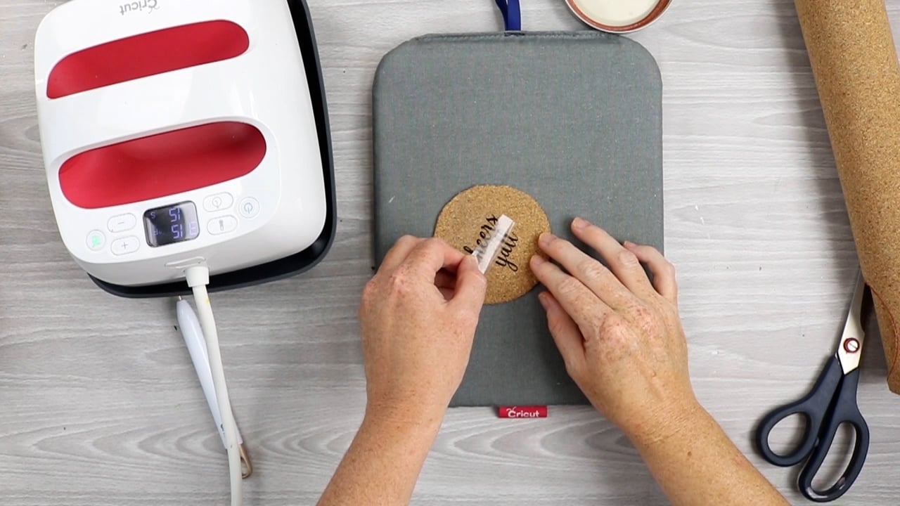 removing carrier sheet from cork