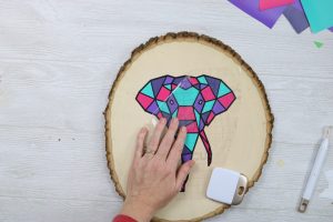 adding vinyl to a wood slice