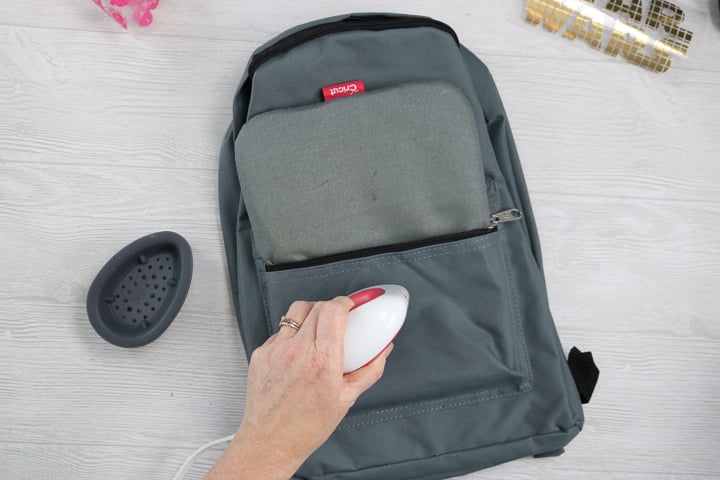 using cricut easypress mini on a backpack