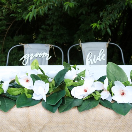 wedding table with diy magnolia garland