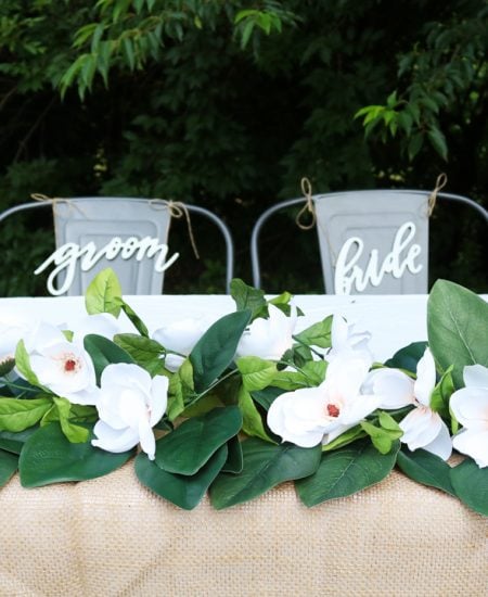 wedding table with diy magnolia garland