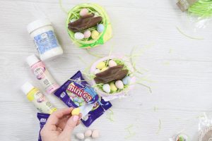 adding candy to an easter mason jar