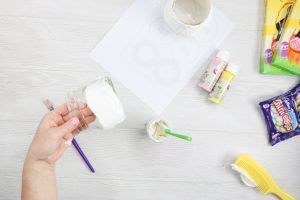 adding testors dimensional craft paste to a mason jar