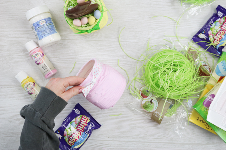 putting ribbon around the top of a mason jar