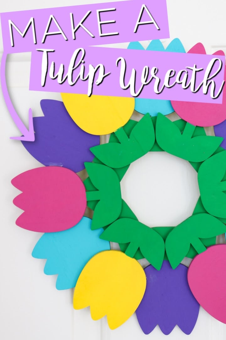 Wooden tulip wreath hanging on door with text overlay saying "make a tulip wreath"
