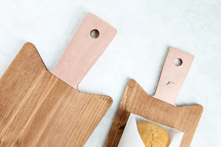 painted handles on a wood cutting board