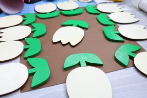 painting leaves and stems of wood tulips