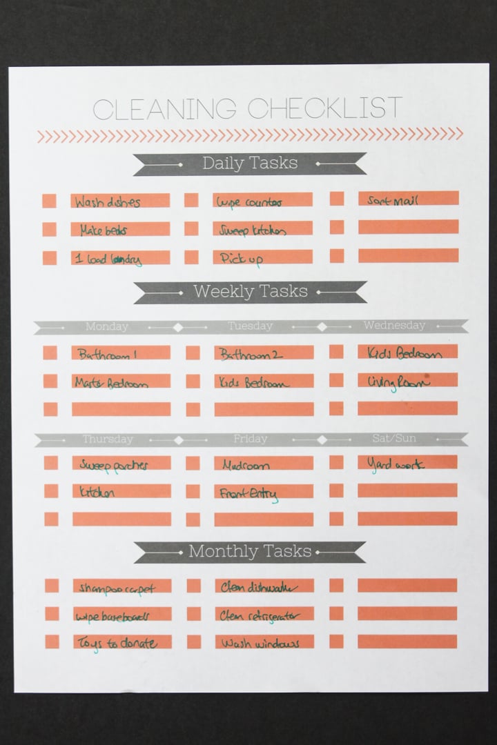 filling out a checklist for cleaning tasks