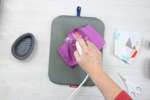 adding heat transfer vinyl to a mask