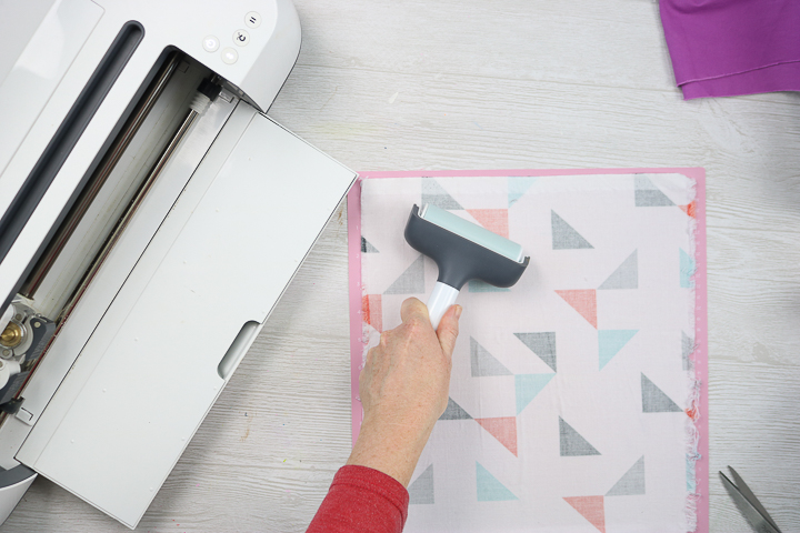 using a brayer on fabric to cut on a cricut maker