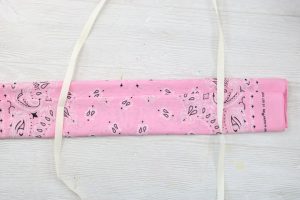 adding string ties to a bandanna face mask