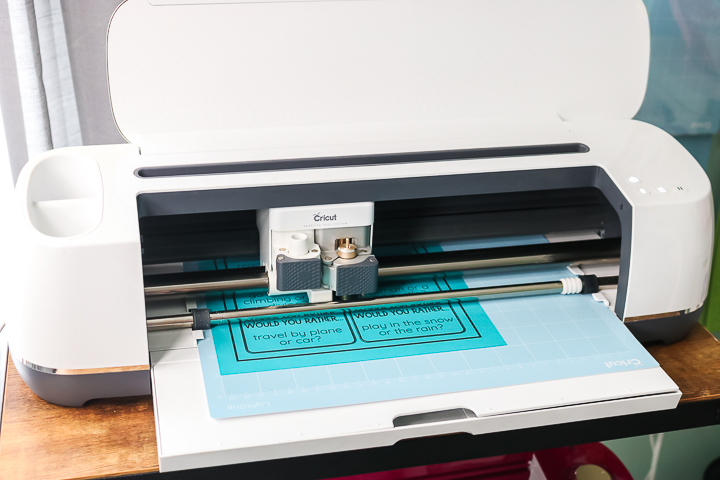 cricut maker cutting colored paper with printing