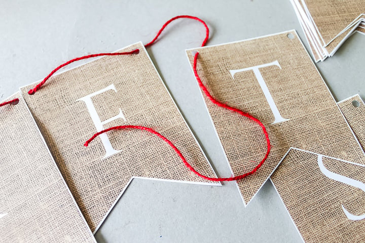 adding twine string to a festive party banner