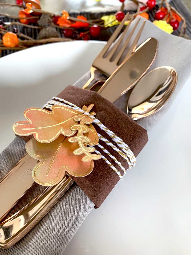 A plate with a fork and knife, with Fall Leaves and Art