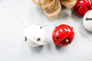 adding jingle bells to a wreath