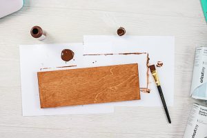 staining a board to make a handmade sign