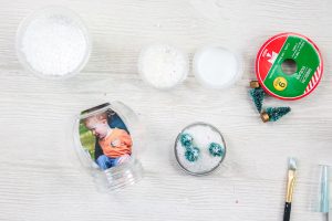 adding trees to a snow globe ornament