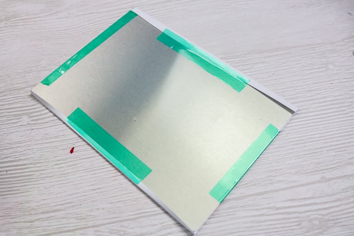 taping copy paper for sublimation to a metal blank