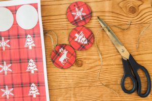 adding twine hangers to ornaments