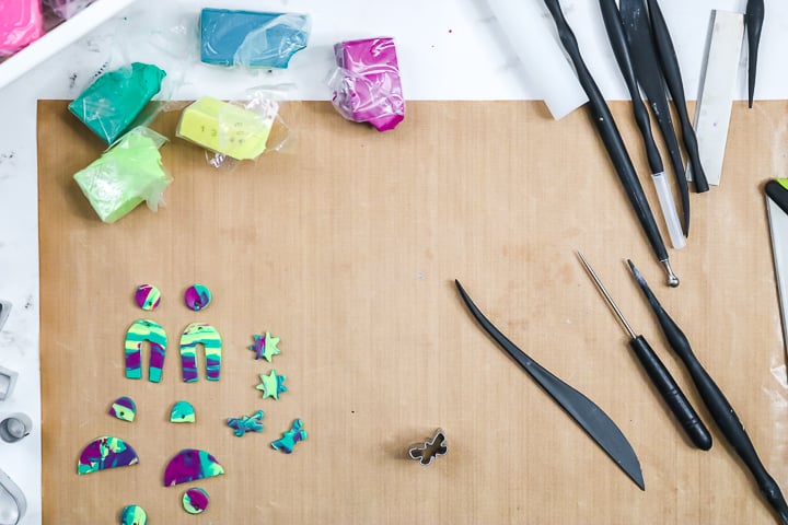 forming and cutting polymer clay on a brown mat