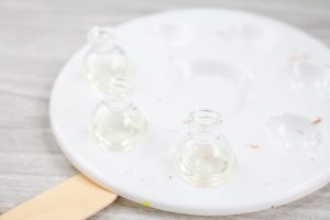 setting glass globes in a try to cure