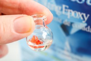 adding fish to the glass bowl