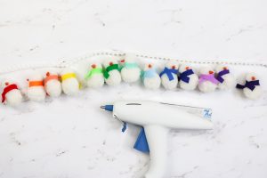 glue gun with pom pom garland