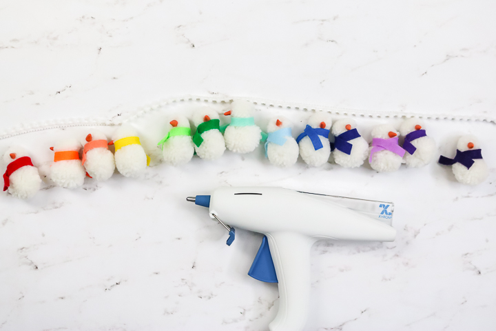 glue gun with pom pom garland