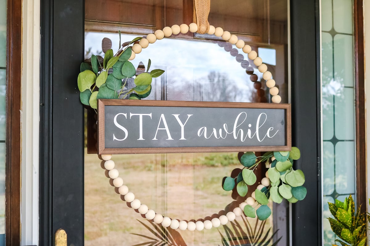 wood bead wreath with a sign