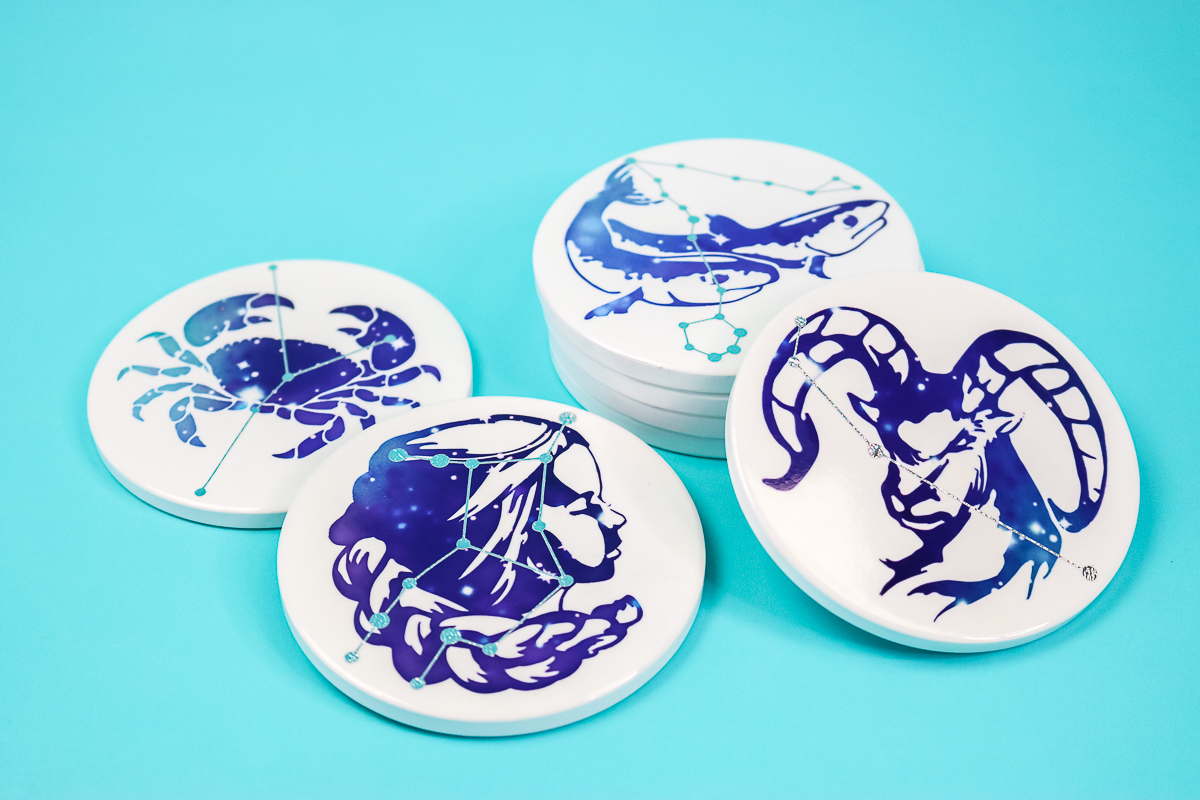 a set of coasters with constellations on a craft table