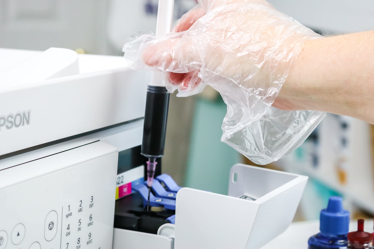 using a syringe to put sublimation ink in an inkjet printer