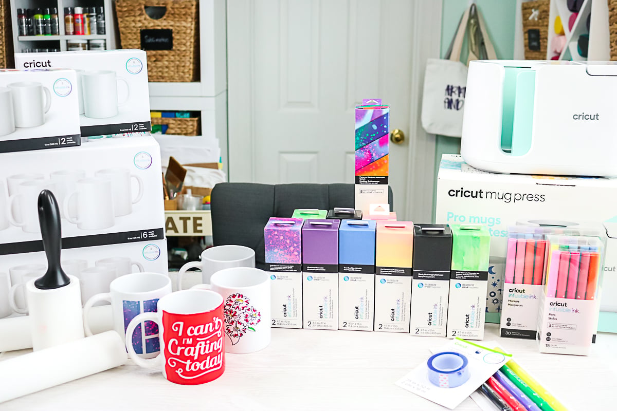 mugs and supplies for Infusible Ink on a table