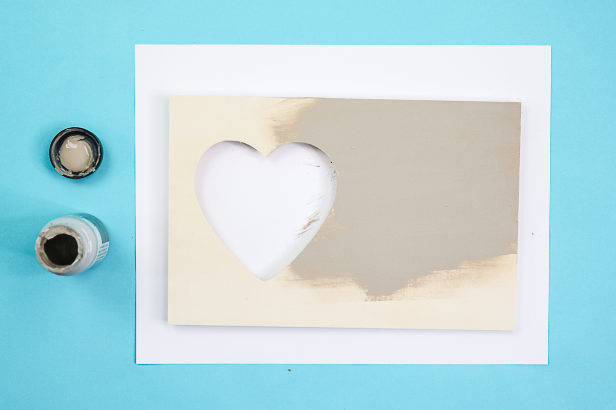 painting a heart cut out picture frame