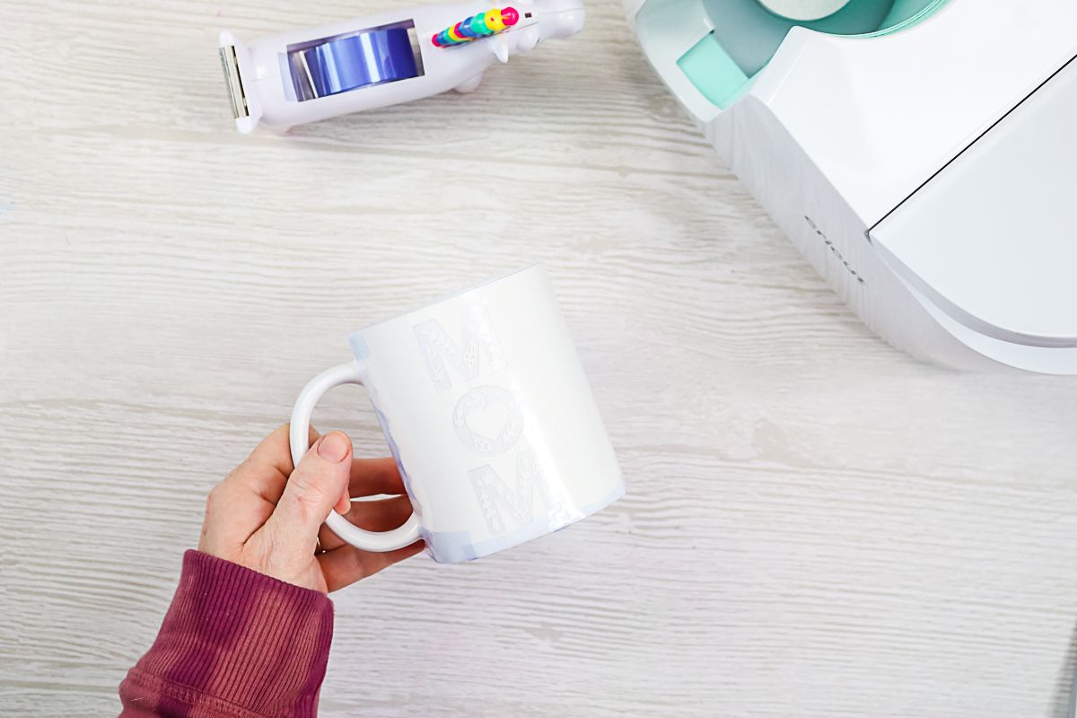 taping design onto a Cricut mug