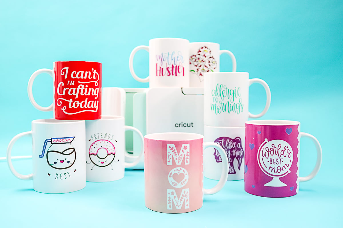 variety of mug designs made on the cricut mug press