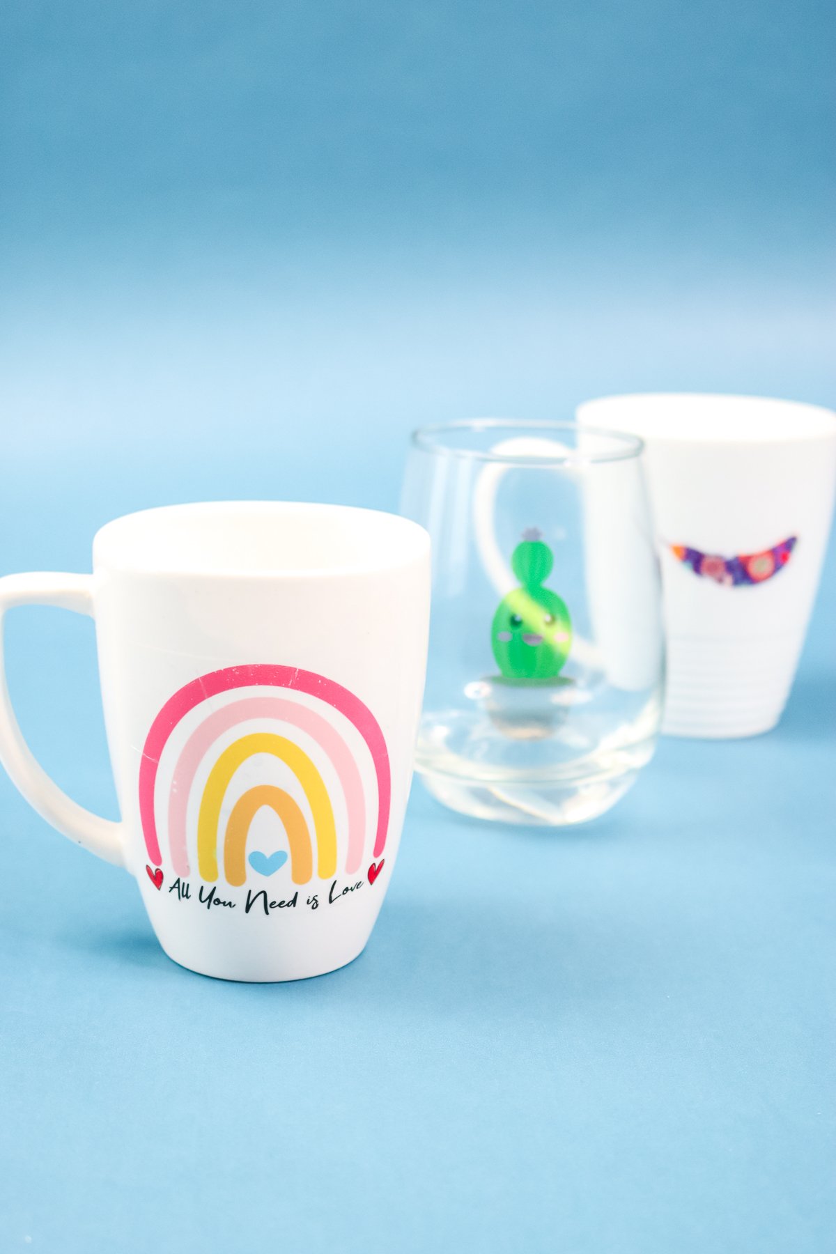 mugs and wine glasses with decals applied