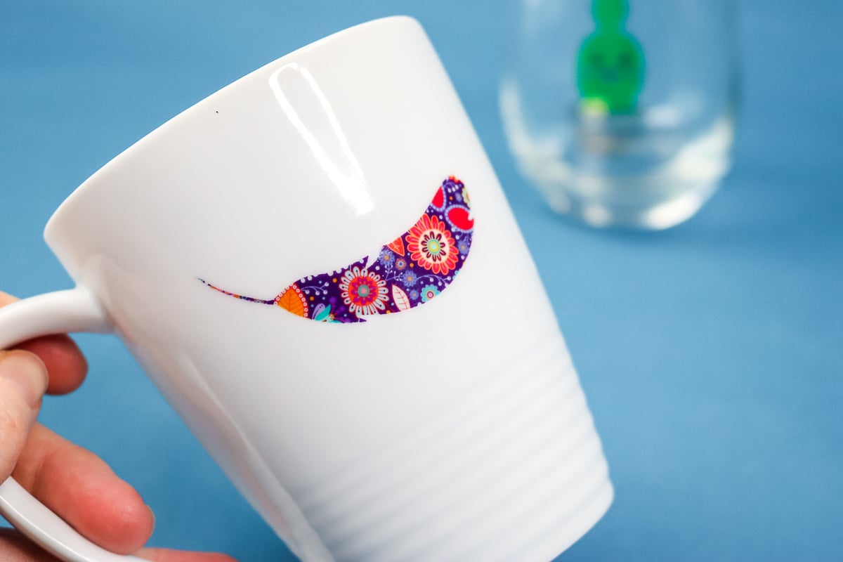 floral feather decal on a white mug