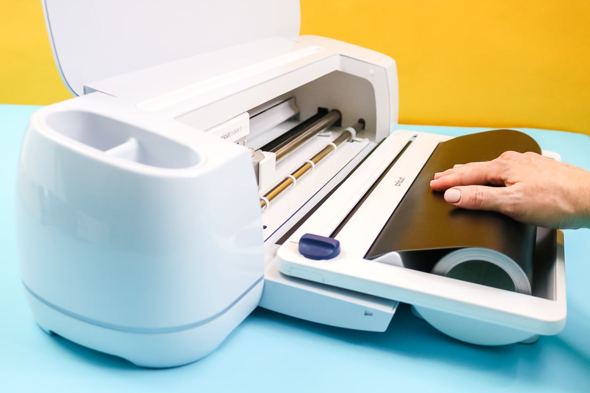 putting smart vinyl in the cricut roll holder