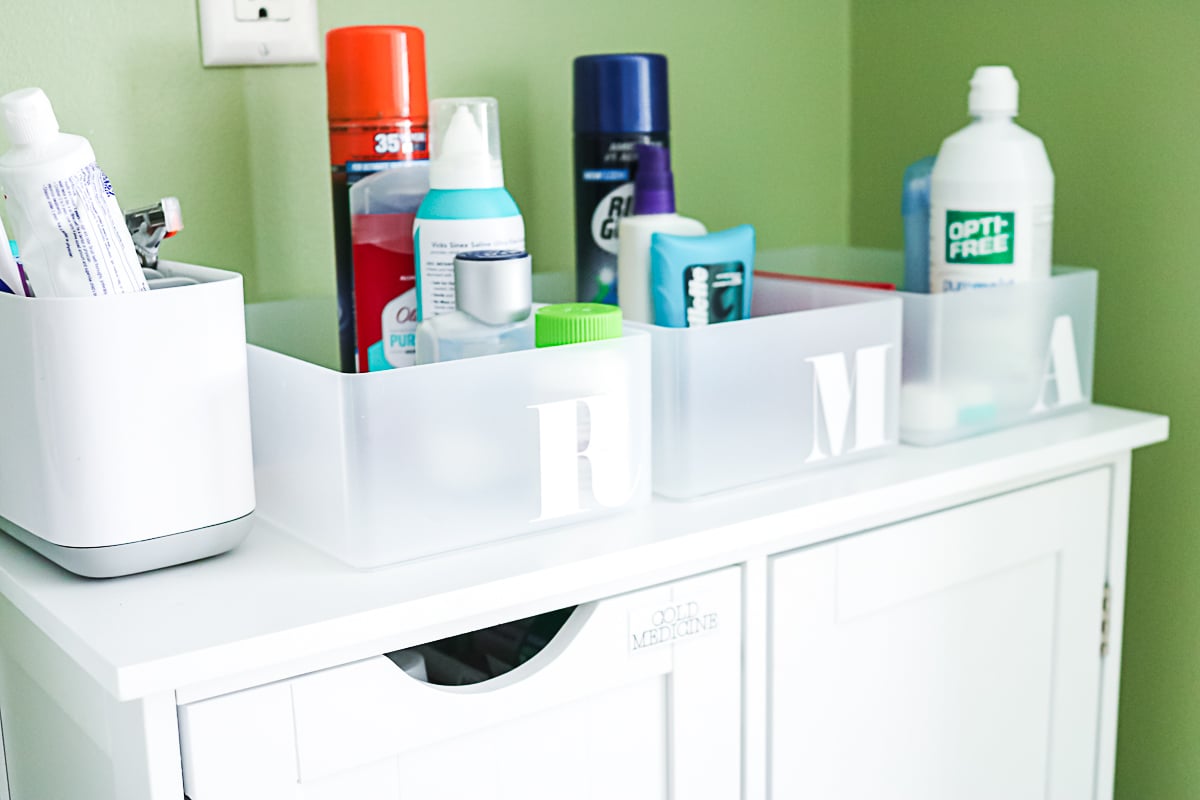 vinyl labels on bins in a bathroom