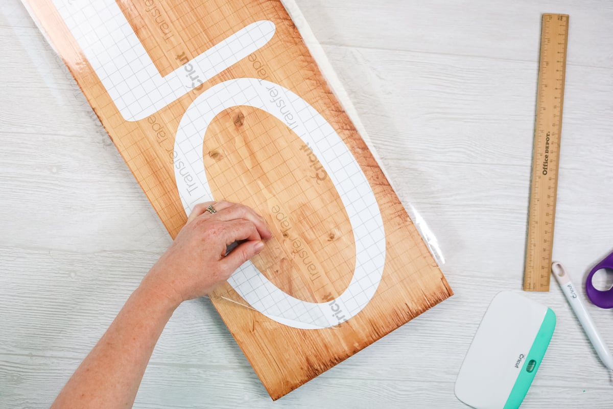 removing transfer tape from a wood sign