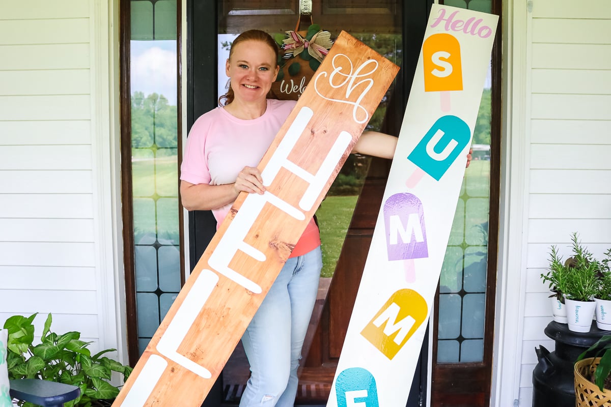 angie holden with signs on a porch