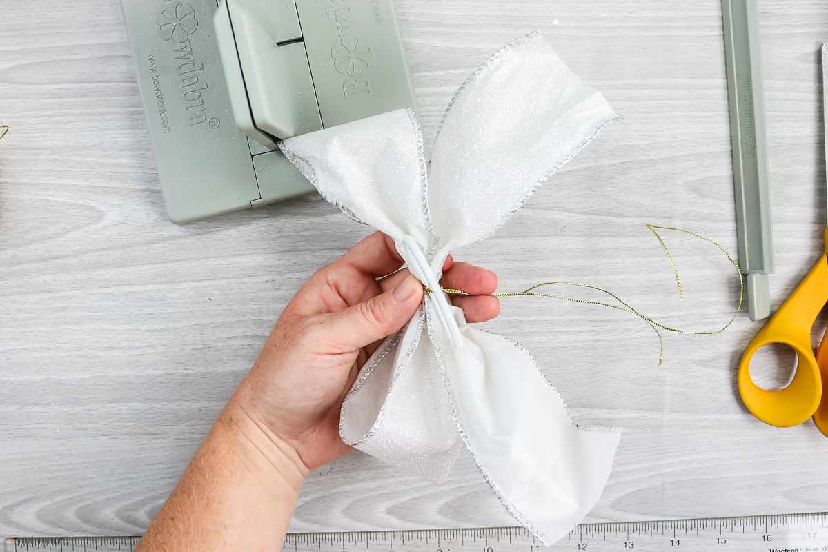 adding hair tie to a ribbon bow