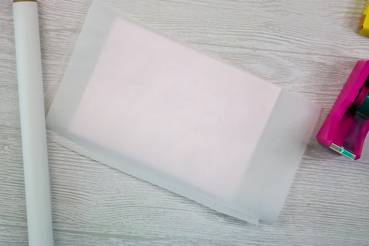 adding protective paper to sublimation blank