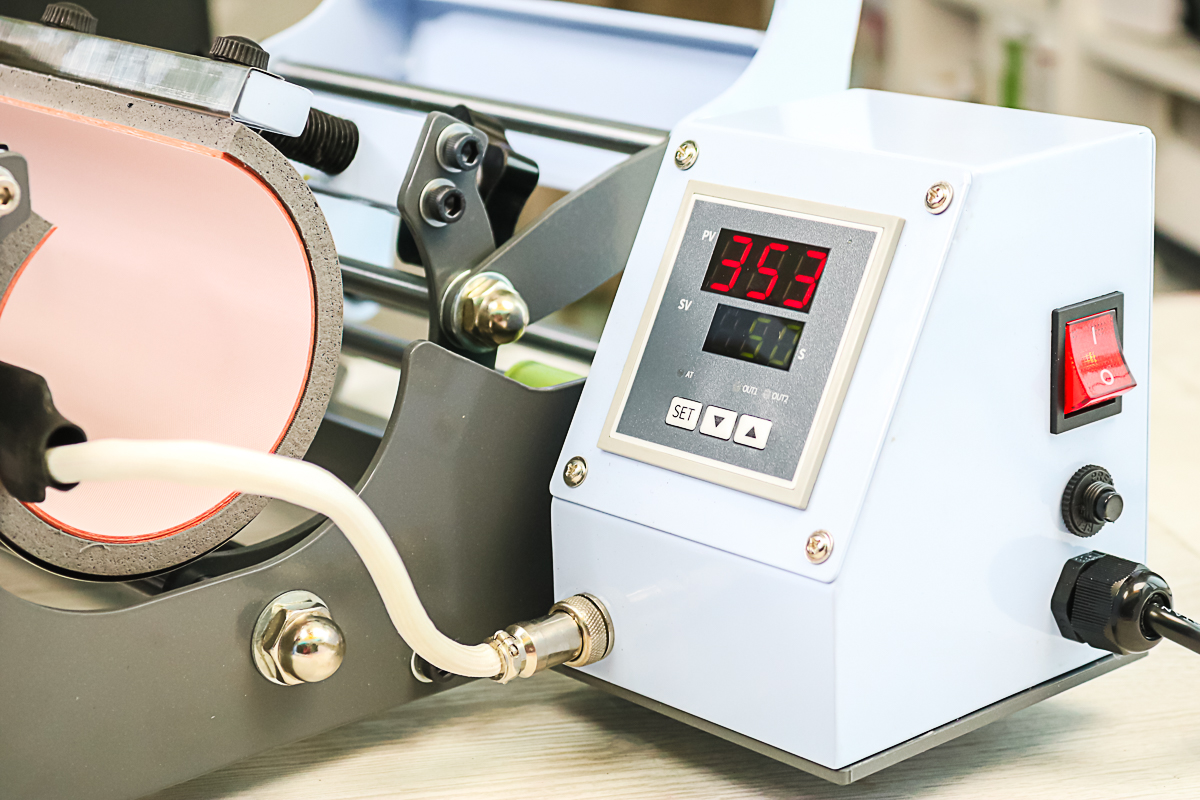 controls on a tumbler press